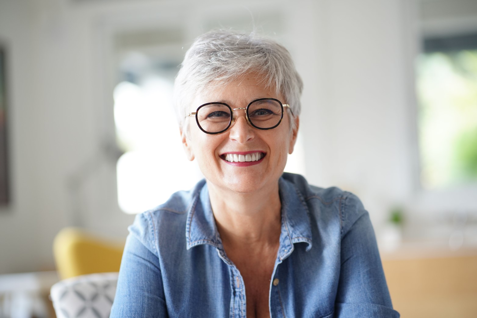 portrait of a beautiful smiling 55 year old woman