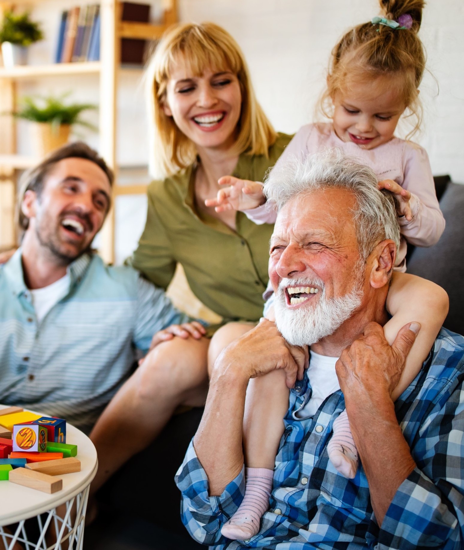 Senior grandparents playing with grandchildren